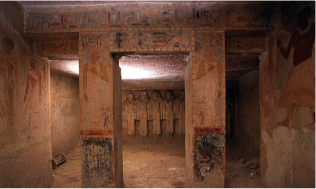 Color photo of painted details on the columns inside a tomb